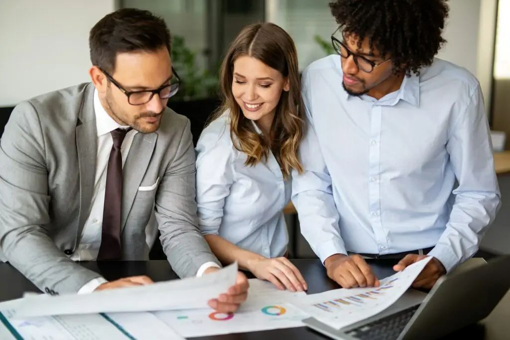 Portrait of successful business people working together in corporate office.
