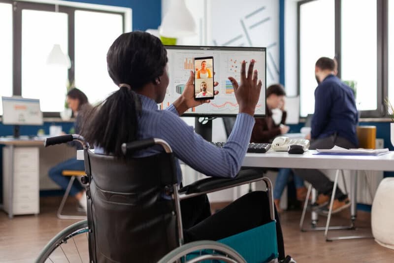 Handicapped disabled african american businesswoman greeting remote teamwork