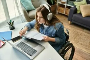 Young woman studying in modern apartment on pc